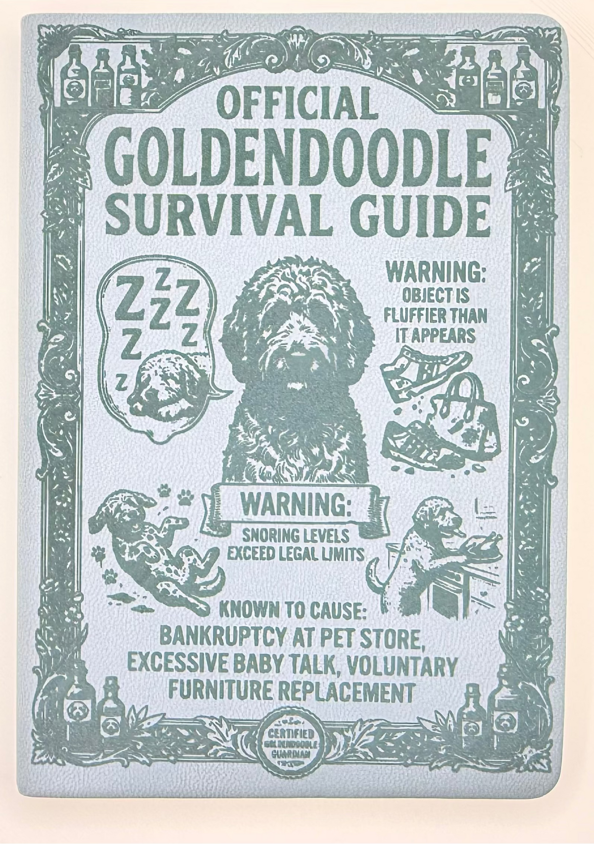 An official Goldendoodle survival guide booklet with a vintage-style teal illustration of a Goldendoodle dog and humorous warning labels, photographed flat on a light beige background.