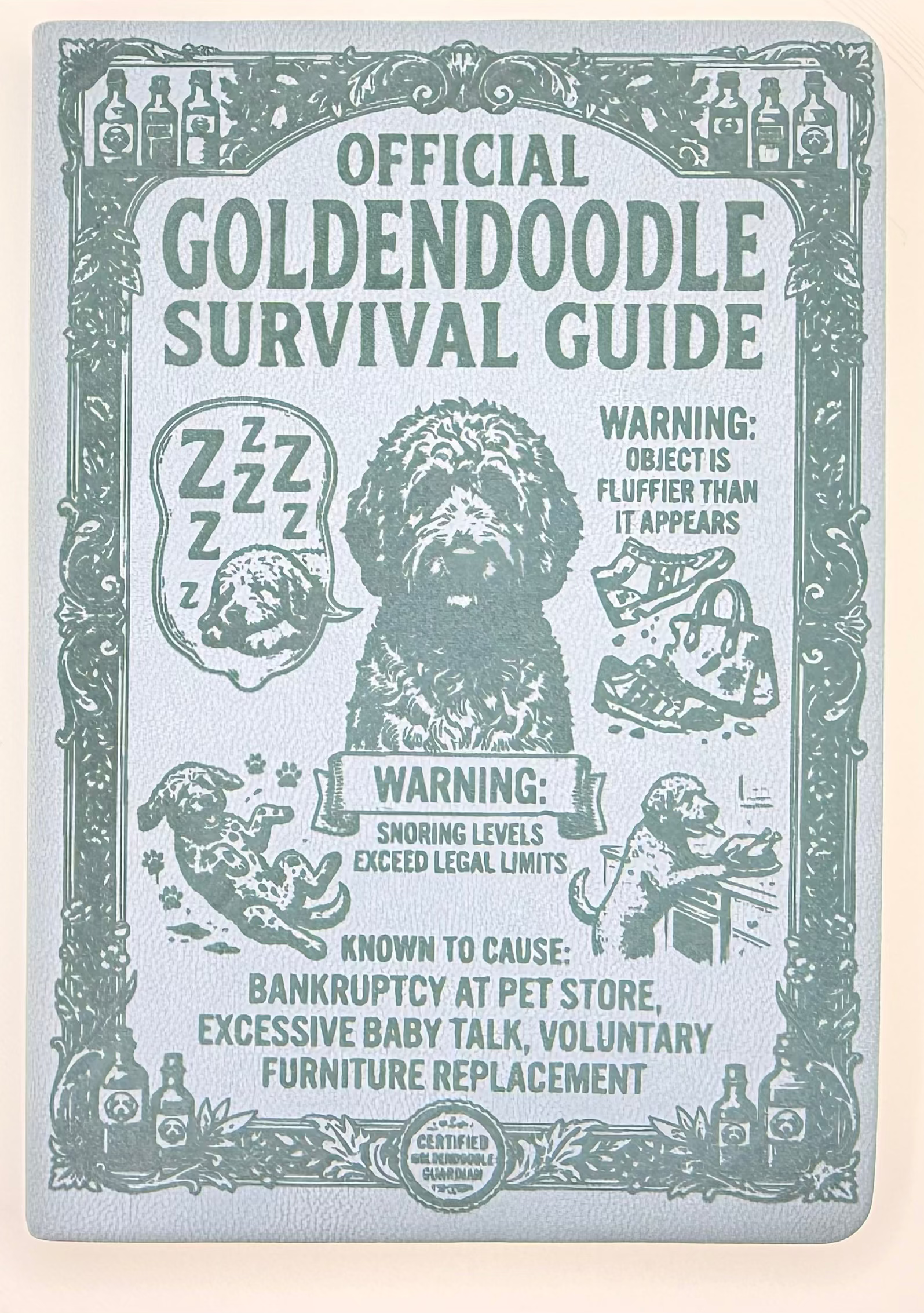 An official Goldendoodle survival guide booklet with a vintage-style teal illustration of a Goldendoodle dog and humorous warning labels, photographed flat on a light beige background.