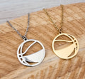 "Basketball cut-out pendant necklace in gold-tone and silver-tone stainless steel"
