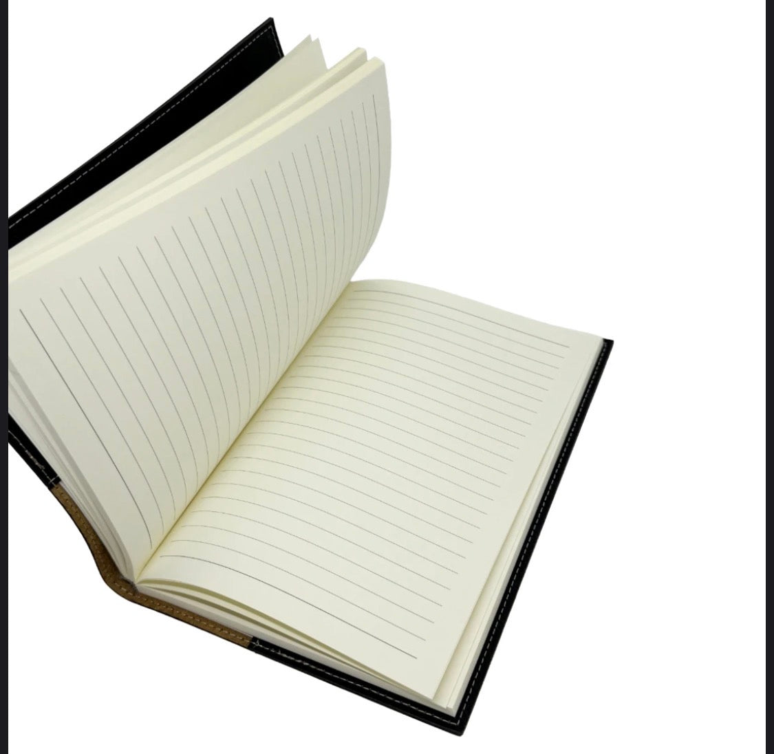 An open lined notebook with cream-colored pages and a black cover, shown against a plain white background.