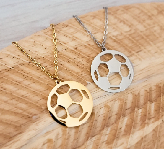 "Soccer ball cut-out pendant necklace in gold-tone and silver-tone stainless steel"
