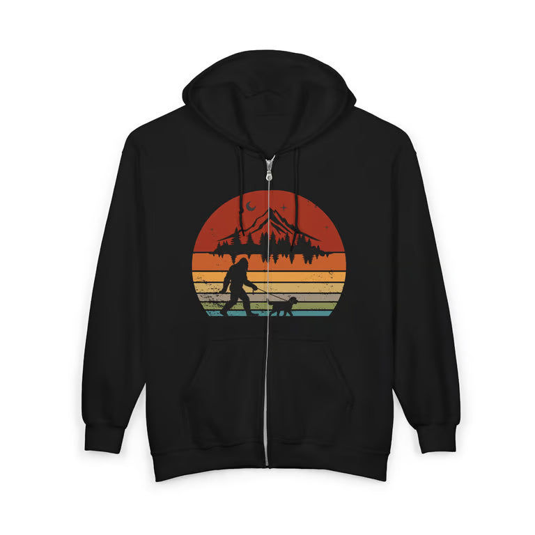 Charcoal gray full-zip hoodie with retro sunset graphic of Bigfoot walking a dog on a leash, mountain and forest silhouette design