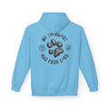 A light blue hoodie shown from the back, featuring a dark gray graphic print with a paw print, the text 'MY THERAPIST HAS FOUR LEGS', and small shield-like icons on a white background.