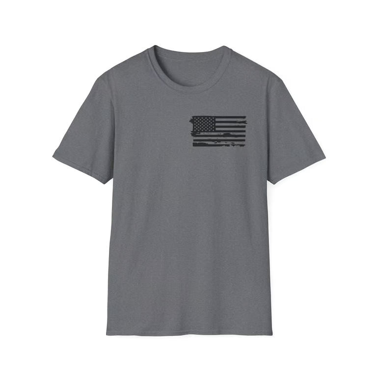 A heather gray short-sleeve crewneck t-shirt featuring a distressed black American flag graphic printed on the left chest, displayed against a solid white background.
