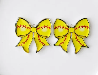 "Softball-print acrylic bow earrings with red stitching detail, perfect for game day outfits"
